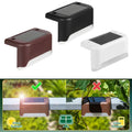 Solar-powered decorative step light installed on outdoor garden stairs at night